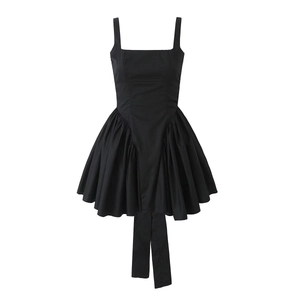 Detailed front view of black sleeveless dress with elegant pleated flared skirt design