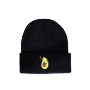 Close-up of cute avocado embroidery with red hearts on a black knitted beanie