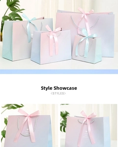 Detail of macaron gradient gift bag with heart pattern and elegant ribbon handles