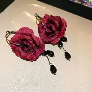 Elegant red rose tassel earrings with black beads and silver pins in vintage gothic style