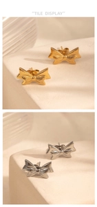 Detail view of bow-shaped stud earrings in polished gold and silver finishes