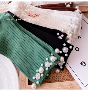 Ribbed cotton socks with pearls and rhinestones in green, black, beige, and brown tones