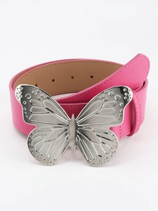 Close-up of pink faux leather belt with a large silver metallic butterfly buckle
