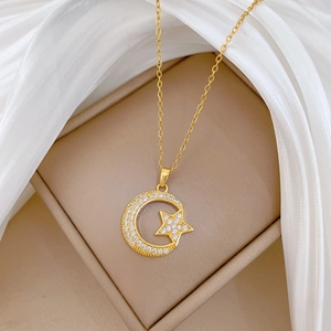 Elegant gold titanium steel necklace featuring a sparkling moon and star zircon pendant