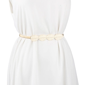 Detail of golden metal leaf elastic waist chain accessory on a white dress