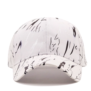 White baseball cap with black ink splash pattern for sun protection and streetwear style