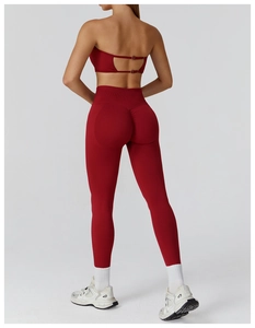 Detail view of red seamless yoga set featuring hollow back top and high-waist scrunch leggings