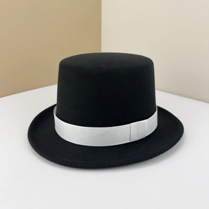 Classic black wool top hat featuring a striking wide white grosgrain ribbon band decoration