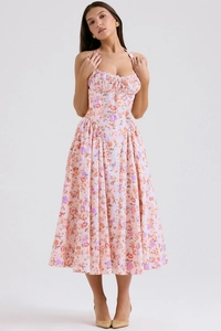 Close-up of pink floral print summer maxi dress featuring a halter neck and corset bodice detail
