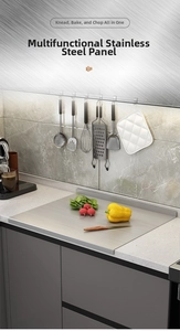 L-shaped stainless steel pastry board with vegetables on a modern kitchen counter