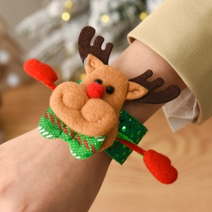 Close-up of a festive Christmas reindeer snap bracelet with brown felt and green sequins