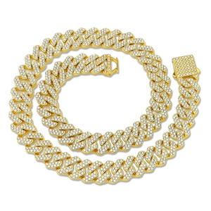 Golden iced out Cuban link chain necklace with sparkling rhinestones and box clasp