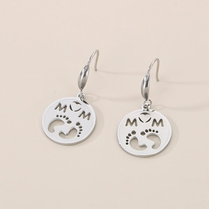 Detailed close-up of silver MOM earrings with hollow circular baby footprints pendant