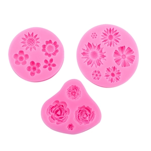 Pink silicone flower mold set including roses and daisies for DIY cake baking and crafts