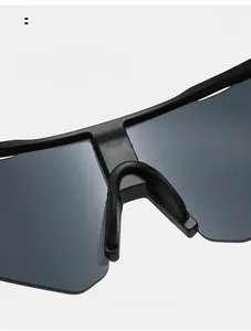 Detail of matte black cycling sunglasses with integrated nose pads and sleek design