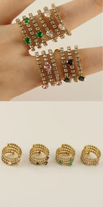 Detail of multi-layer heart ring with colorful zircon stones in gold finish