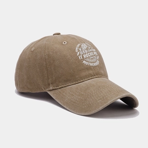 Detail of washed khaki cotton baseball cap featuring vintage rock print and skull design