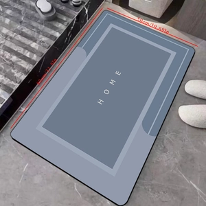 Detail view of the 80x50cm gray diatom mud bath mat with HOME text and non-slip texture