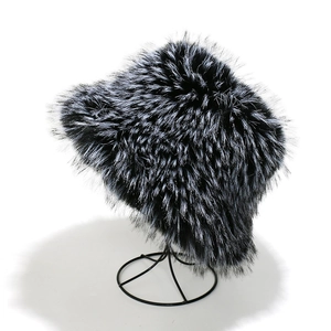 Detailed view of thick gradient faux fox fur winter bucket hat on a display stand