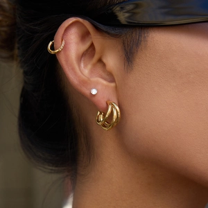 Elegantly layered 14k gold plated stainless steel hoops and diamond stud earring set