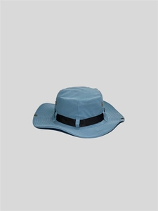 Detail of blue outdoor boonie hat showing metal eyelets and black decorative webbing strap