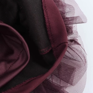 Detailed close-up of wine red mesh stitching and black knit lining with reinforced seams