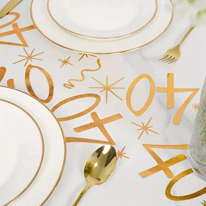 Detail of white mesh table runner with gold stamped 40th birthday stars and numbers