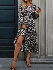 Detailed view of elastic waist and leopard print texture on a long sleeve dress