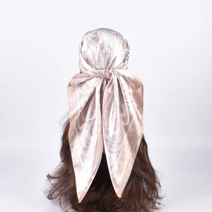 Champagne silk-feel paisley square scarf worn as a stylish headscarf for women