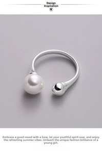 Detailed close-up of S925 sterling silver open ring with a white pearl and polished ball