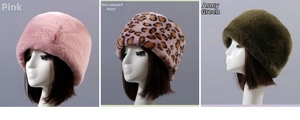 Detail of warm faux rabbit fur winter hats in pink, leopard print, and army green