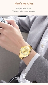 Close-up of a men's gold stainless steel watch with diamond accents on the wrist