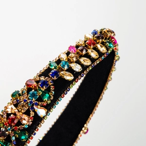 Baroque wide headband featuring vibrant multicolored crystals on a black velvet base