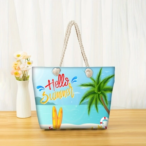 Detail of canvas beach tote with rope handle and Hello Summer tropical graphics