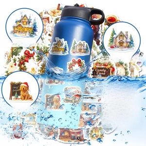 Close-up of waterproof PVC Christmas stickers on a water bottle with splashing water drops