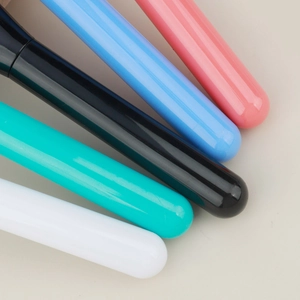Close-up of sleek colorful handles for ultra-thin flat foundation makeup brushes
