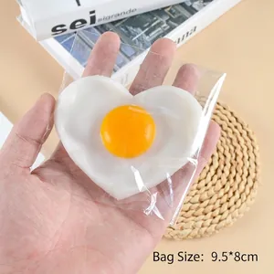 Realistic heart-shaped fried egg keychain made of soft PVC with 9.5x8cm packaging size