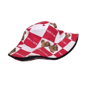 Detail of red and white checkered bucket hat with cute teddy bear and NOBI KUMA text print
