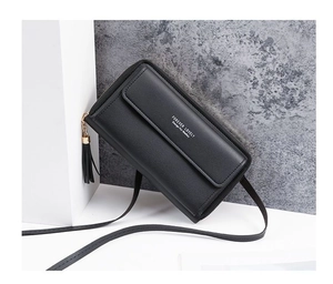 Detail of black PU leather phone bag with gold zipper, tassel, and printed logo lettering