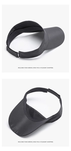 Detail of dark grey sun visor featuring breathable mesh fabric and adjustable velcro strap
