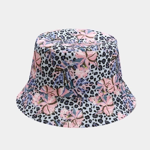 Detail shot of leopard print fisherman hat featuring vibrant pink floral patterns