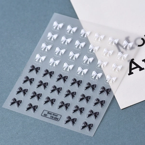 Macro detail of 5D embossed black and white ribbon bow nail art stickers model TS-054