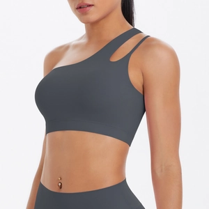 Detailed view of dark grey one-shoulder sports bra with unique hollow strap design