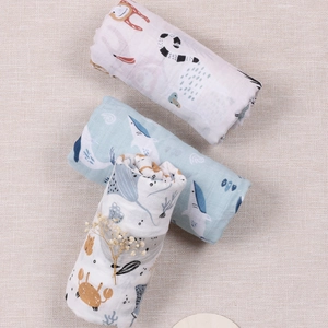 Three-pack cotton muslin swaddle blankets with whale, crab, and lemur animal patterns