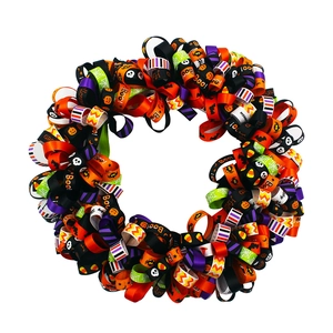 Detail of Halloween decorative wreath made with patterned orange, black and purple ribbons