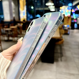 Detail showing two silver laser wave phone cases with iridescent glossy finish for iPhone