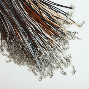 Detail of colorful wax cords with silver lobster clasps and extension chains for necklaces