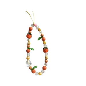Handmade beaded phone strap with pink tulip, orange persimmon, and green leaf charms