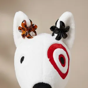 Elegant floral leopard pattern and black hair claw clips set shown on a plush toy