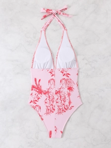 Detailed top view of pink tropical palm floral swimsuit with halter neck and V-neckline